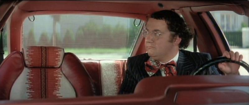 Coluche at the Wheel